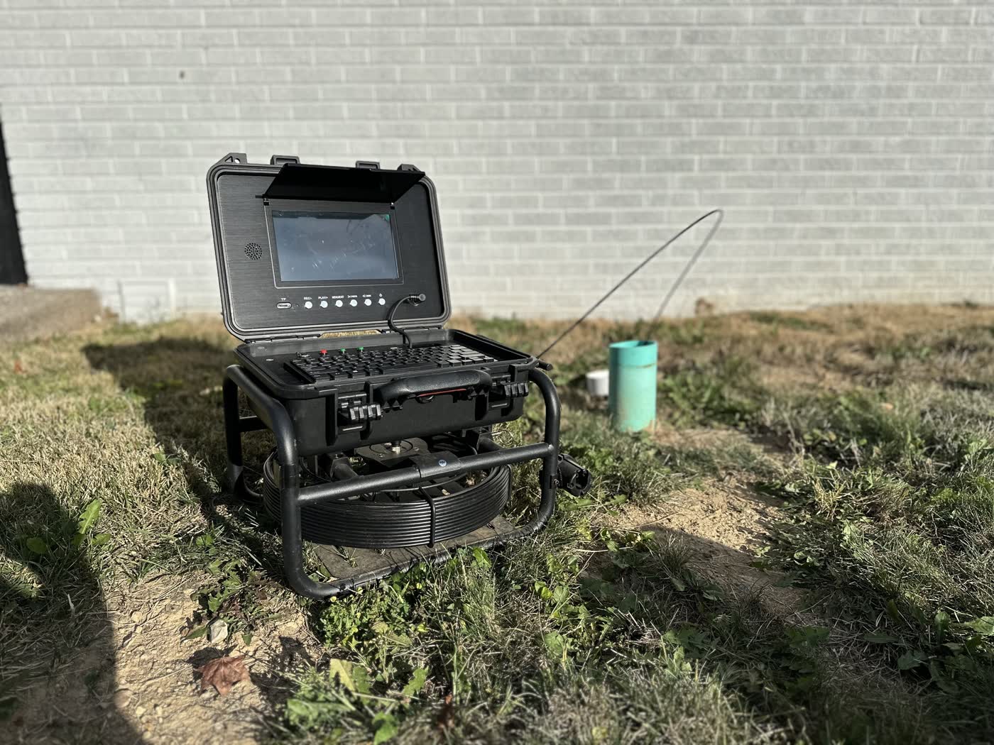 Sewer scope camera and self-contained monitor reel ready for a residential inspection.